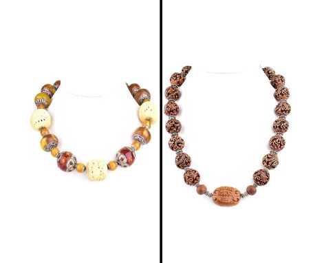 Two (2) Vintage Chunky Bead Necklaces. One with amber and carved ivory beads, silver clasp. The other with carved beads. Sign