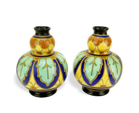 Two (2) Vintage Regina Gouda Pottery Vases. Signed. Measures 8-1/4" H. Domestic Shipping: $68.00 Min Est. $100.00 Max Est. $1