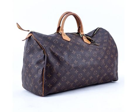 Louis Vuitton Brown Monogram Coated Canvas Speedy 40 Tote. Golden brass hardware, vachetta straps. Brown canvas interior with