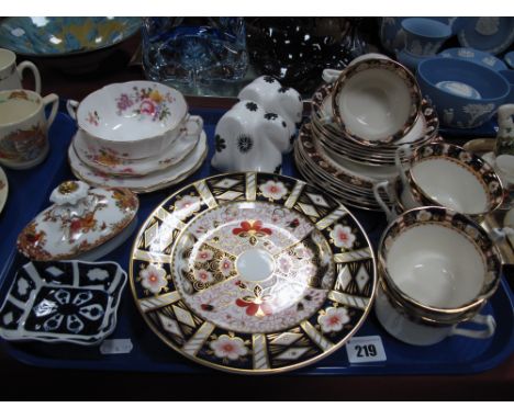 Two Royal Crown Derby Paperweights, modelled as snakes in white with black motifs (one first quality and one second quality).