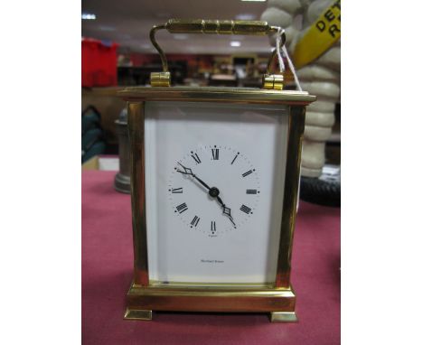 A XX Century Oversized Brass Carriage Clock by Shortland Bowen, with white enamel dial with Roman numerals, carrying handle, 