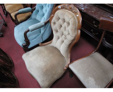 A XIX Century Walnut Spoon Back Nursing Chair, with carved top rail, upholstered button back, upholstered seat on carved cabr