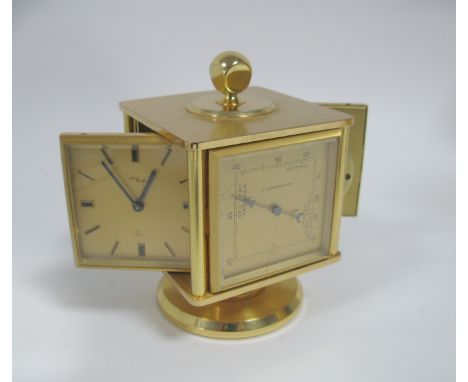 A Desk Compendium, with a 15 jewel eight day alarm clock, barometer, thermometer and hygrometer.