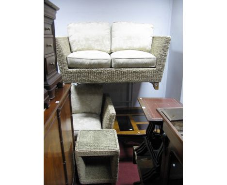 A Rattan Three Piece Conservatory Suite comprising two seater sofa, armchair and a glass topped occasional table, all in wove