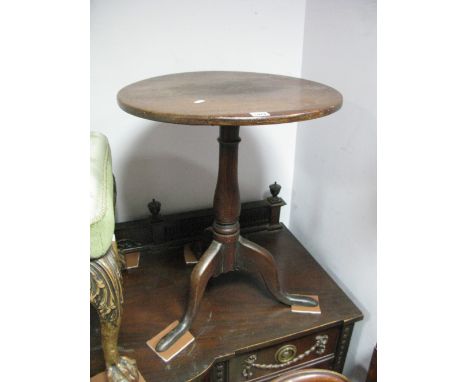 A George III Oak and Elm Snap Top Tripod Table, circular top on ring turned slender baluster column, splayed feet.