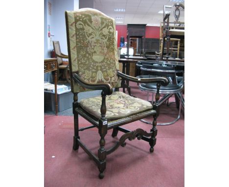 A XX Century Charles II Style Chair, with a tapestry back, shaped arms, caned seat, on turned and block supports, with arched