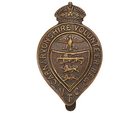 Welsh. Carnarvonshire Volunteer Regiment WWI VTC cap badgeGood die-stamped bronze crowned pear shaped title enclosing Borough