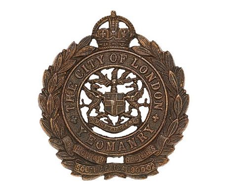 City of London Yeomanry, Rough Riders OSD cap badge. Scarce small die-cast bronze crowned title circlet resting in laurel spr