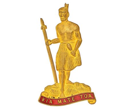New Zealand. 8th (Southland) Regiment Officer’s post 1911 cap badge.Fine scarce die-stamped gilt Maoari warrior standing on g
