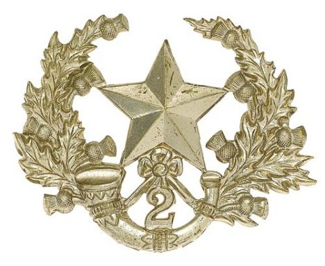 Scottish. 2nd (Hamilton) VB Cameronians glengarry badge circa 1887-1908.Die-stamped white metal Mullet over strung bugle with