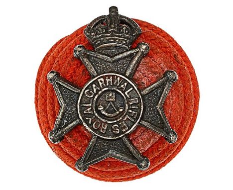 Indian Army. Royal Garhwal Rifles Officer’s red cord boss bearing silvered badge circa 1922-45.Scarlet cord boss bearing crow