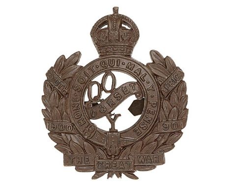 Dorset Yeomanry post 1920 OSD cap badge.Die-cast bronze crowned Garter on laurel sprays bearing South Africa 1900-1901; “QO D