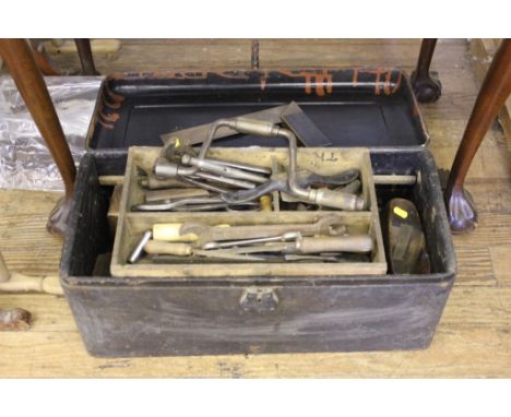 A tin box of carpentry tools, including a brass and rosewood square from Buck and Hickman and two saws