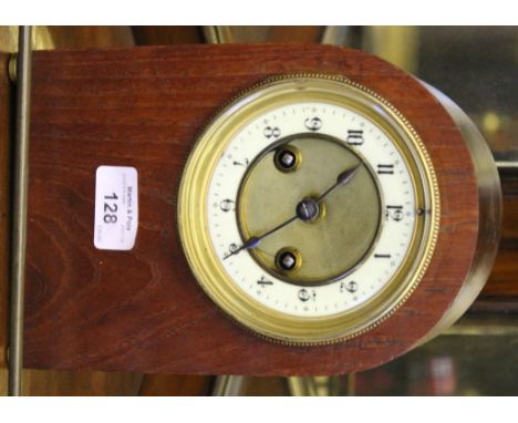 A late 19th century clock movement and brass dial with enamel chapter ring in later arched case, dial 12cm diameter, case 22c