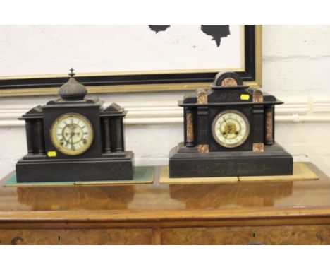 A Victorian slate mantel clock, with domed top over an architectural style case, the enamelled dial with exposed escapement. 