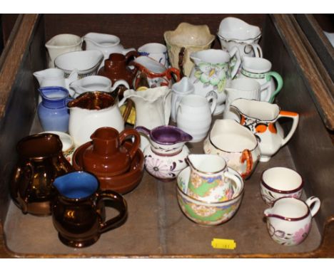 A collection of miniature jugs, including lustreware, Carltonware and Hammersley 