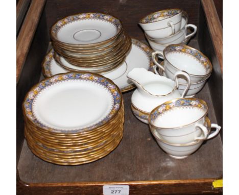 A Tuscan porcelain tea service comprising thirty-four pieces