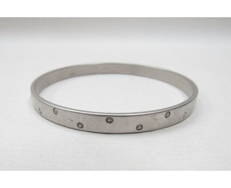 A vintage Swarovski frosted metal bangle set with fine white crystals 