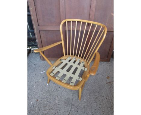 An Ercol lounge chair light elm