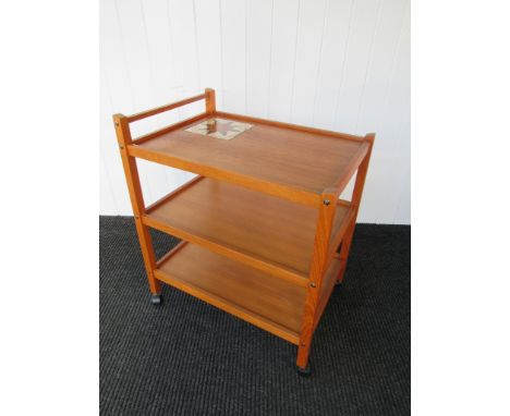 A BRDR Furbo Danish trolley in teak of three tiers, inset tile to top