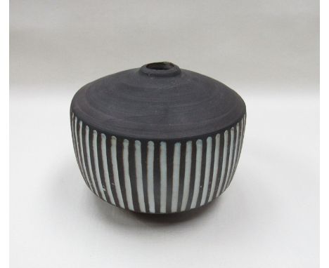 A Briglin pottery vase, blackened glaze with white filled vertical incised lines.  Impressed marks 11cm high (minor chipping 