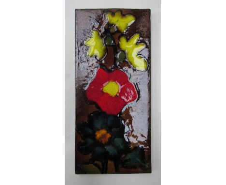 A West German wall tile, red, green, yellow flowers, 32cm x 14.5cm