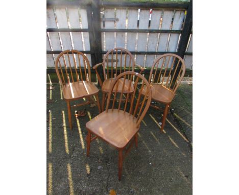 A set of four Ercol light elm chairs and one carver