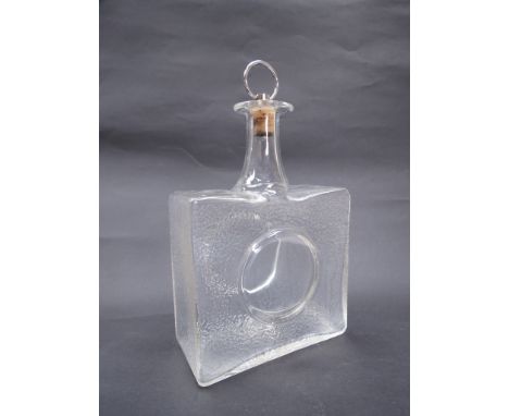 A clear glass decanter by Iitalla, Finland, designed by Tapio Wirkkala, signed TW. 17cm high