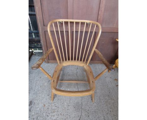 An Ercol light elm lounge chair 