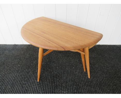 An Ercol light elm drop leaf coffee table 