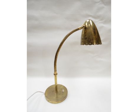 A brass desk lamp with adjustable neck. Star pierced shade 
