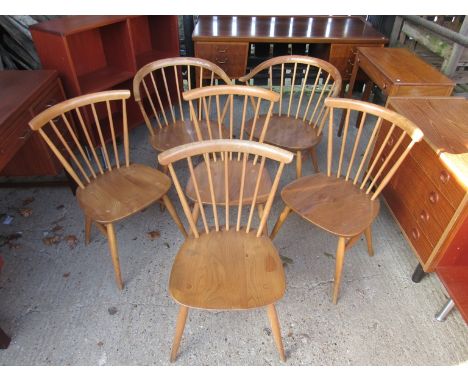 A set of six Ercol light finish dining chairs, two cowhorn carvers and four chairs, 1960's, all stamped 