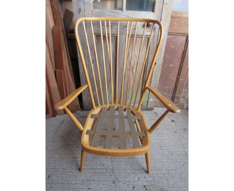 An Ercol light elm lounge chair 