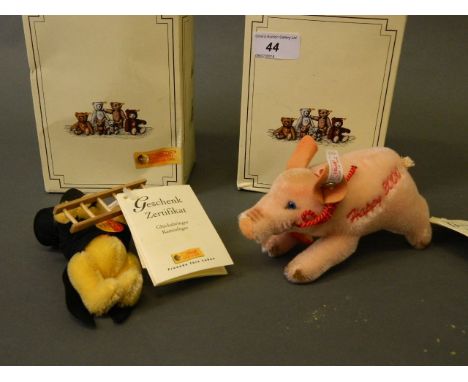A Steiff Lucky Millennium Pig, with tags and buttons, and a Steiff Lucky chimney sweep, both in original boxes, pig 6'' long