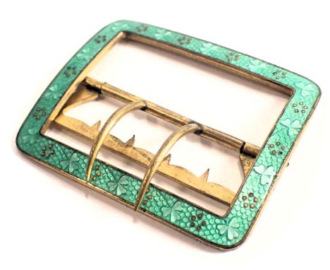 An enamel belt buckle, of rectangular design, with green enamel clover border, with brass backing, 5cm x 6cm.
