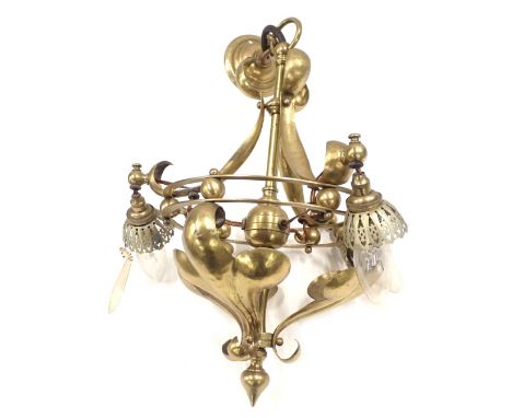 An early 20thC brass Art Nouveau light fitting, of three branch design, with shaped and fluted scrolls, 37cm high. 