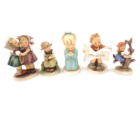 Five Goebel Hummel figures, to include children reading and playing. (5) 