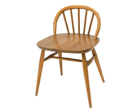 An Ercol light coloured beech and elm dressing stool, with low back, on turned legs. 