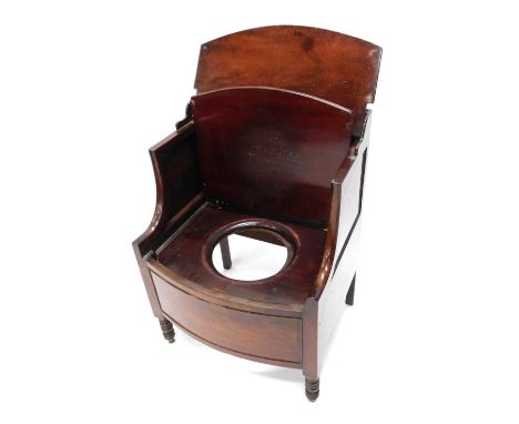 An early 19thC mahogany commode, the top with a hinged lid, with shaped arms and a further hinged section enclosing a recess 
