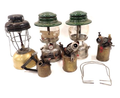 Two Colman's paraffin lamps, a camping lamp, and three part brass blow torches. (6)