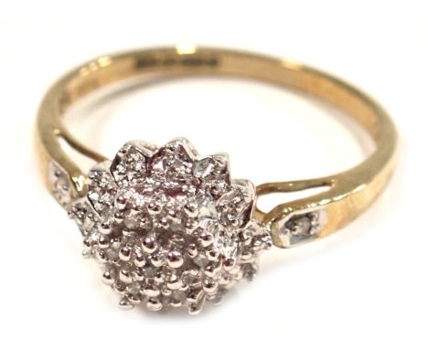 A 9ct gold diamond cluster ring, the raised flora cluster set with tiny diamonds, totalling 0.05ct, with a raised basket and 