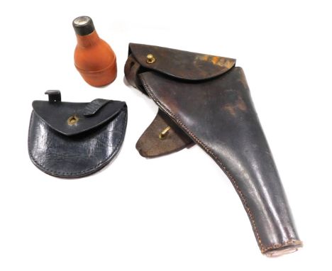 A brown leather gun holster, a leather ammunition pouch, etc. 