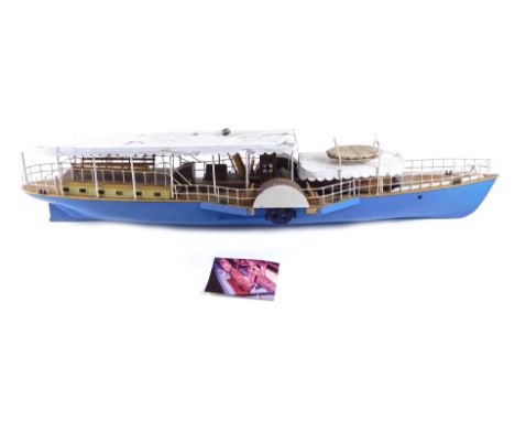 A kit built scale model paddle steamer, with blue hull and white roof, 85cm long.