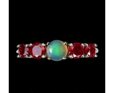 A 925 silver ring set with a cabochon cut opal and rubies, (N.5).