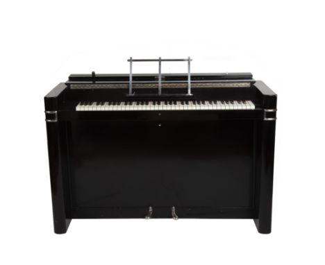 An Eavestaff mini-piano in art deco style, ebonised case, stamped no. 12200, 29cm wide