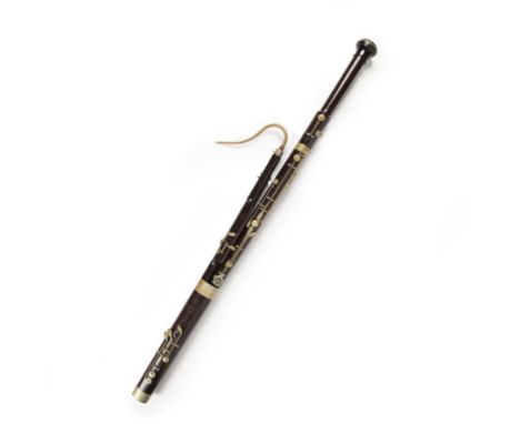 A Hawkes &amp; Son rosewood and metal mounted bassoon, in four sections, stamped Excelsior Class, Hawkes &amp; Son Denman Str