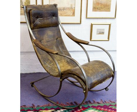 ROCKING CHAIR, late 19th/early 20th century steel framed after R. W. Winfield with brown leather padded seat, 61cm W. (with f