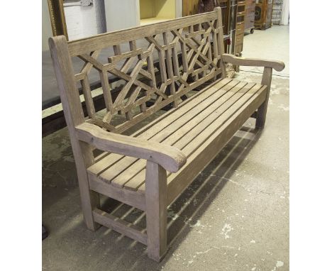 JULIAN CHICHESTER GARDEN BENCH, weathered teak with lattice back and slatted seat stamped 'Julian Chichester', 182cm W.