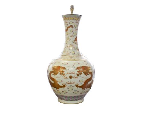 CHINESE BOTTLE VASE LAMP, Famille Rose decorated with the five clawed dragon chasing the flaming pearl, 73cm.