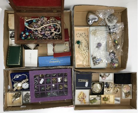 A collection of costume jewellery to include various brooches, earrings, beaded necklaces, scarf ties etc